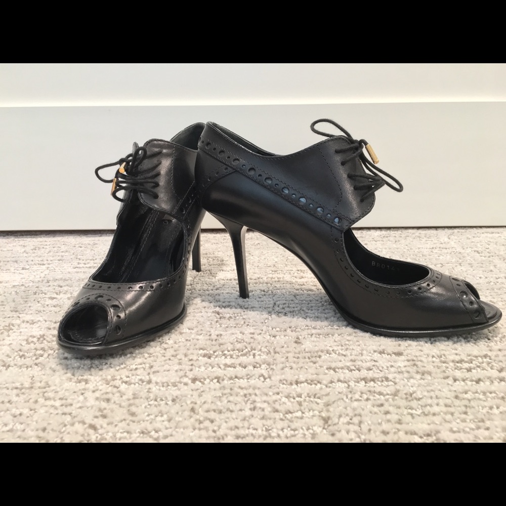 Black peep toe Louis Vuitton saddle pumps